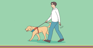 Man with cane walking down road