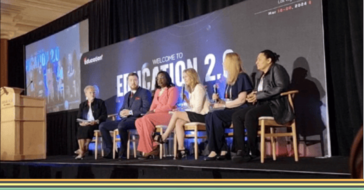 Panel of speakers on stage at an event